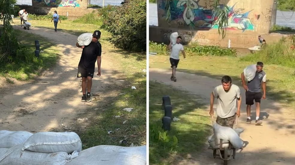 Los vecinos de Colastin&eacute; Sur colocan bolsas de arena para protegerse ante la crecida del r&iacute;o